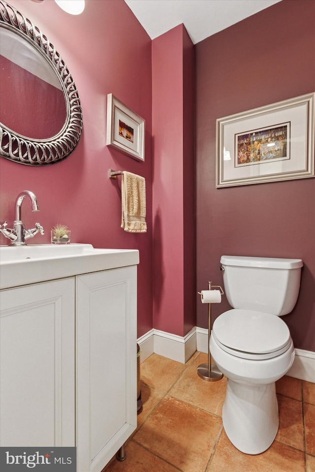 214 E Willow Grove Ave, Philadelphia, PA 19118 - half bathroom featuring baseboards, toilet, tile patterned flooring, and vanity
