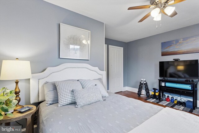 214 E Willow Grove Ave, Philadelphia, PA 19118 - bedroom with wood finished floors, baseboards, and a ceiling fan