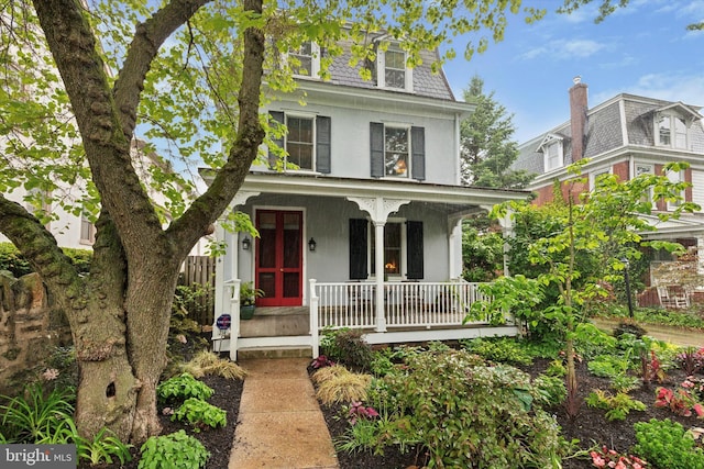 214 E Willow Grove Ave, Philadelphia, PA 19118 - second empire-style home featuring covered porch and mansard roof