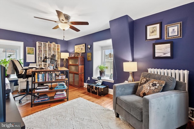 214 E Willow Grove Ave, Philadelphia, PA 19118 - living area with ceiling fan, wood finished floors, and baseboards