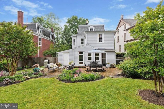 214 E Willow Grove Ave, Philadelphia, PA 19118 - back of house with a patio area, an outdoor living space, and mansard roof