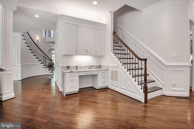 7845 Montvale Way, Mclean, VA 22102 - unfurnished office with a decorative wall, crown molding, built in desk, dark wood-style flooring, and recessed lighting