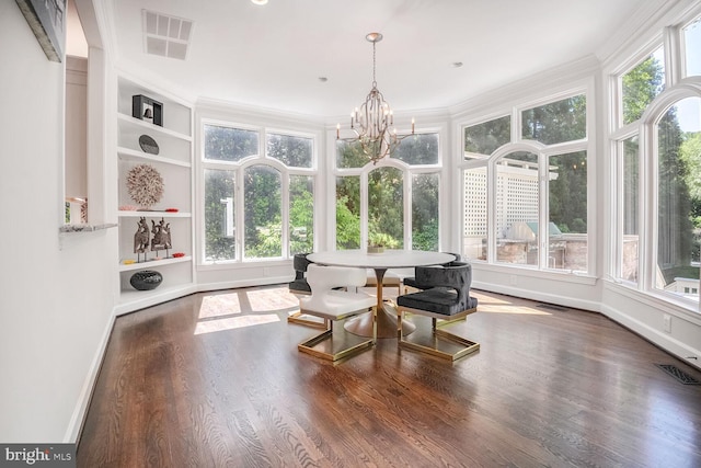 7845 Montvale Way, Mclean, VA 22102 - sunroom / solarium featuring baseboards, wood finished floors, ornamental molding, and a chandelier