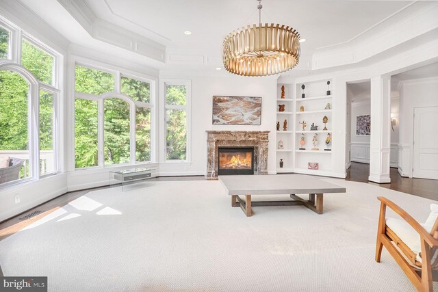 7845 Montvale Way, Mclean, VA 22102 - living room featuring ornamental molding, a premium fireplace, ornate columns, built in features, and a chandelier