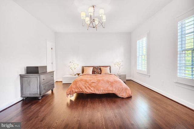 7845 Montvale Way, Mclean, VA 22102 - bedroom with a chandelier, dark wood-style floors, and baseboards