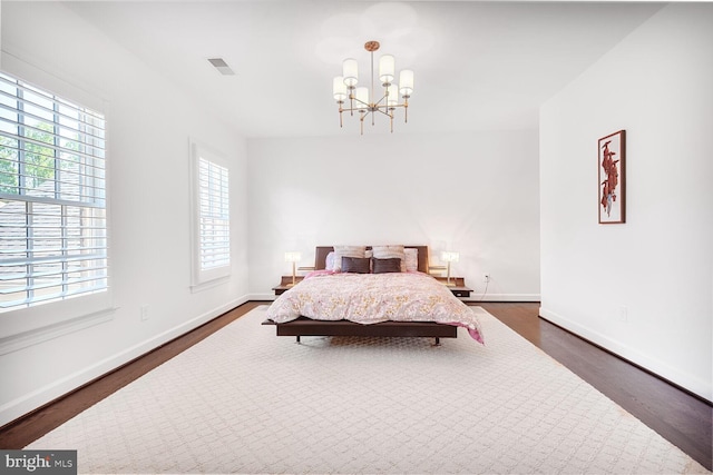 7845 Montvale Way, Mclean, VA 22102 - bedroom featuring dark wood-style flooring, a chandelier, and baseboards
