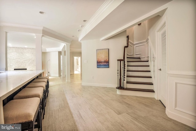 7845 Montvale Way, Mclean, VA 22102 - unfurnished living room featuring crown molding, stairway, recessed lighting, baseboards, and decorative columns