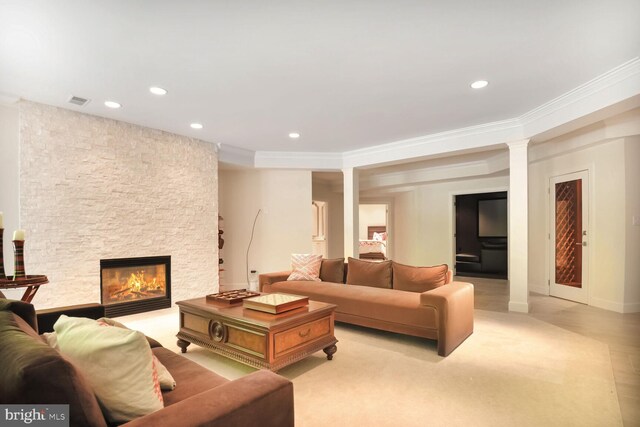 7845 Montvale Way, Mclean, VA 22102 - living room featuring a stone fireplace, recessed lighting, and ornamental molding