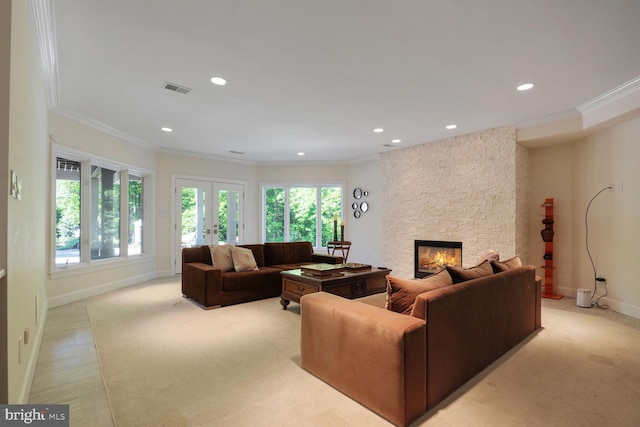 7845 Montvale Way, Mclean, VA 22102 - living room featuring crown molding, french doors, a stone fireplace, recessed lighting, and baseboards