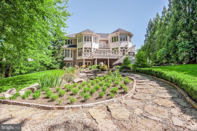 7845 Montvale Way, Mclean, VA 22102 - back of house with a sunroom, a wooden deck, a yard, and stairway