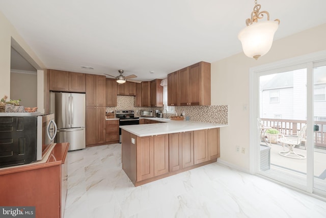 6005 Southward Way, Alexandria, VA 22315 - kitchen featuring stainless steel appliances, a peninsula, brown cabinets, tasteful backsplash, and light countertops