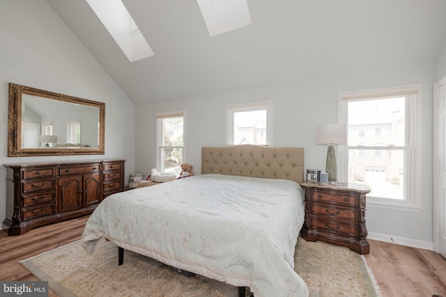 6005 Southward Way, Alexandria, VA 22315 - bedroom with a skylight, wood finished floors, and lofted ceiling