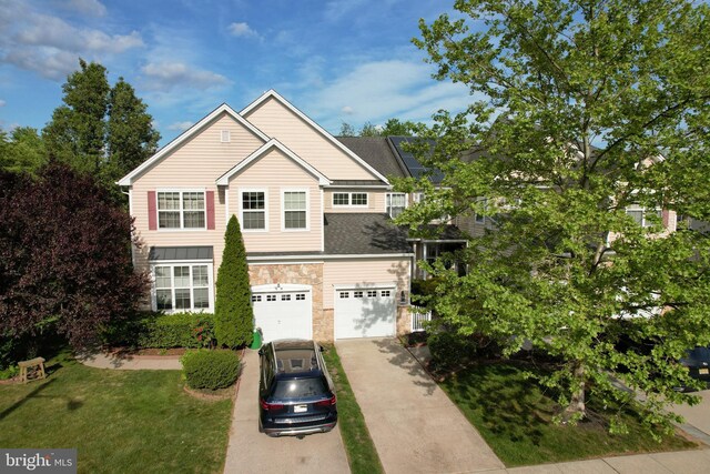 36 Crows Nest Ct, Mount Laurel, NJ 08054 - traditional-style home with an attached garage, concrete driveway, stone siding, and a front lawn