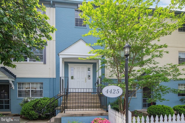 4425 Romlon St Unit 103, Beltsville, MD 20705 - entrance to property featuring brick siding and fence