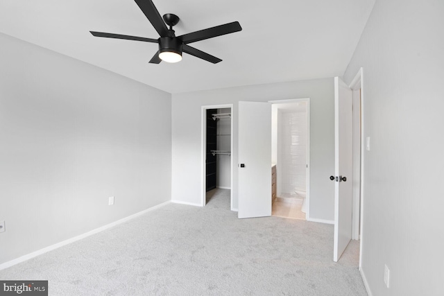 4425 Romlon St Unit 103, Beltsville, MD 20705 - unfurnished bedroom with a walk in closet, light colored carpet, a closet, baseboards, and ceiling fan