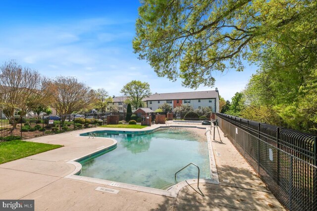 4425 Romlon St Unit 103, Beltsville, MD 20705 - community pool with fence, a patio, and a residential view