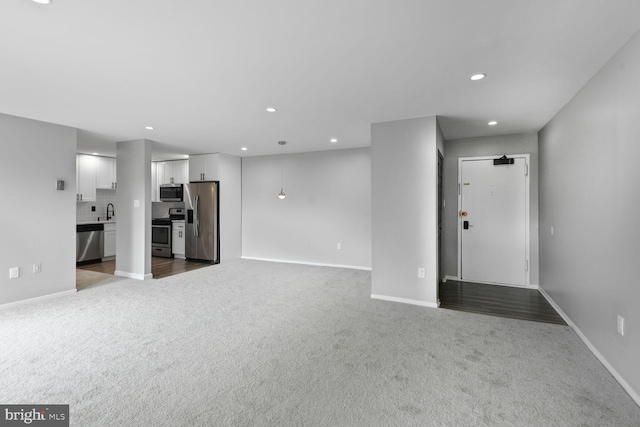 4425 Romlon St Unit 103, Beltsville, MD 20705 - unfurnished living room with carpet floors, a sink, baseboards, and recessed lighting