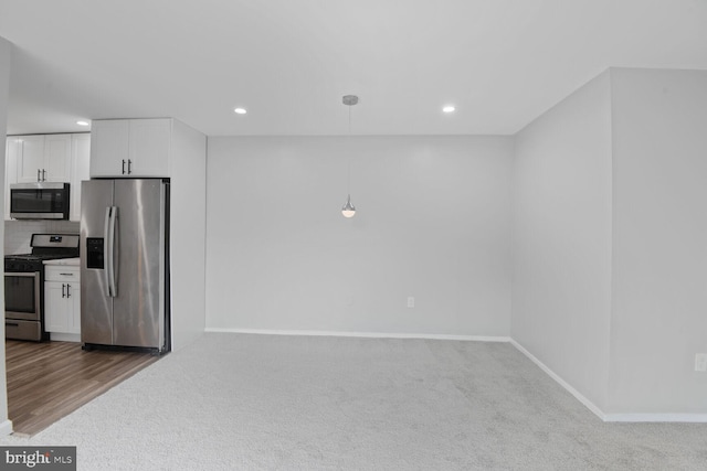 4425 Romlon St Unit 103, Beltsville, MD 20705 - kitchen featuring stainless steel appliances, white cabinets, recessed lighting, carpet floors, and baseboards