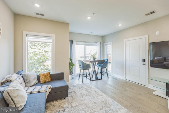 2812 Georgia Ave NW Unit 6, Washington, DC 20001 - living area featuring wood finished floors, healthy amount of natural light, recessed lighting, and baseboards