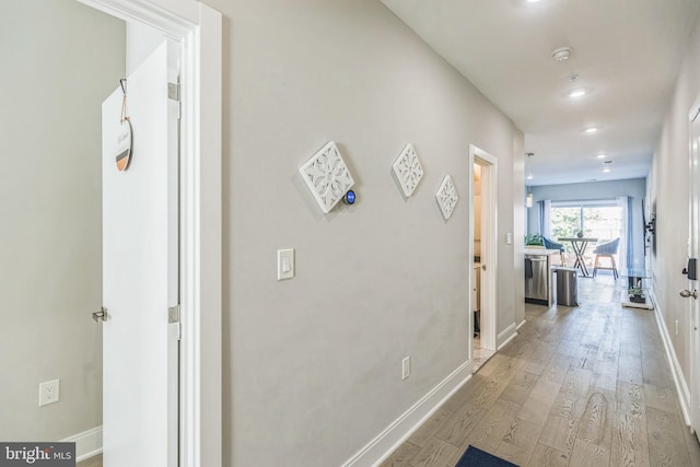 2812 Georgia Ave NW Unit 6, Washington, DC 20001 - hall featuring baseboards, wood finished floors, and recessed lighting