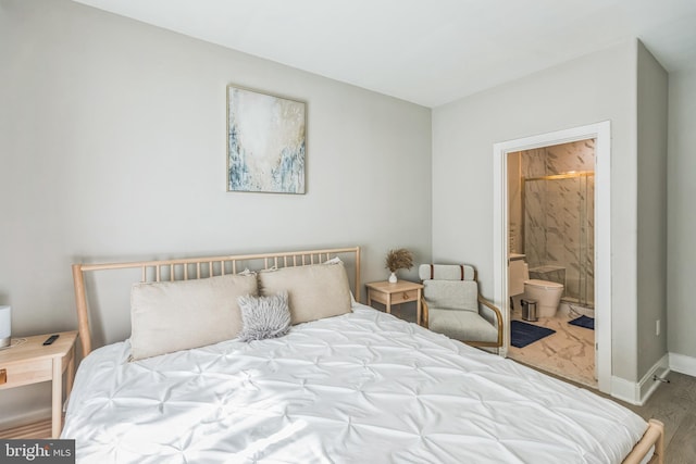2812 Georgia Ave NW Unit 6, Washington, DC 20001 - bedroom with baseboards, ensuite bath, and wood finished floors