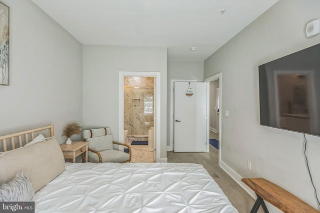 2812 Georgia Ave NW Unit 6, Washington, DC 20001 - bedroom featuring wood finished floors, baseboards, and ensuite bathroom