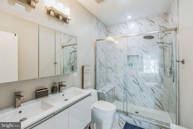2812 Georgia Ave NW Unit 6, Washington, DC 20001 - bathroom featuring toilet, a marble finish shower, double vanity, and recessed lighting
