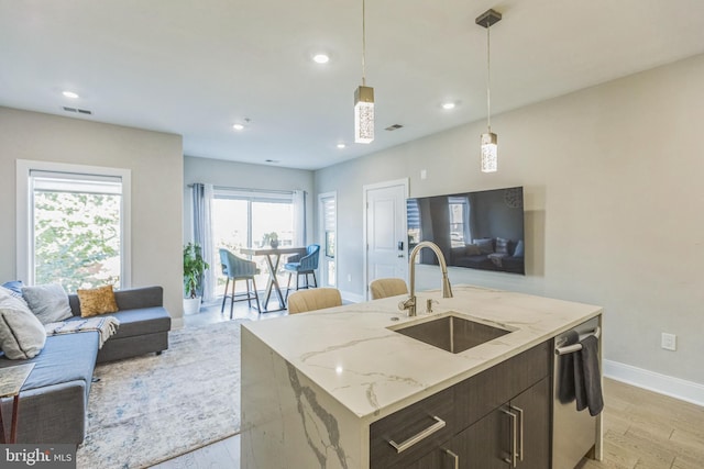2812 Georgia Ave NW Unit 6, Washington, DC 20001 - kitchen with open floor plan, a sink, light wood-type flooring, baseboards, and recessed lighting