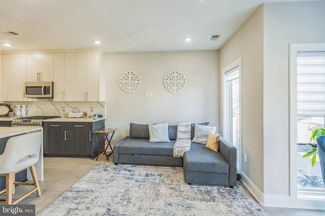 2812 Georgia Ave NW Unit 6, Washington, DC 20001 - living room featuring plenty of natural light, recessed lighting, light wood-style floors, and baseboards