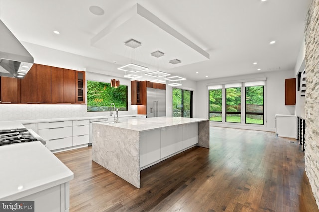 3546 N Utah St, Arlington, VA 22207 - kitchen with appliances with stainless steel finishes, modern cabinets, wall chimney exhaust hood, wood finished floors, and recessed lighting
