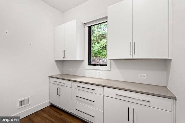 3546 N Utah St, Arlington, VA 22207 - kitchen featuring white cabinets, baseboards, and dark wood-style floors