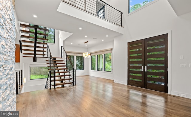 3546 N Utah St, Arlington, VA 22207 - entryway featuring stairs, a high ceiling, wood finished floors, recessed lighting, and a chandelier