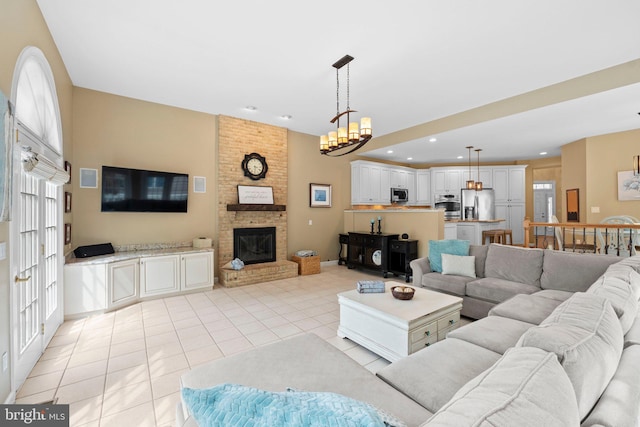 living room featuring light tile patterned floors, a brick fireplace, and recessed lighting