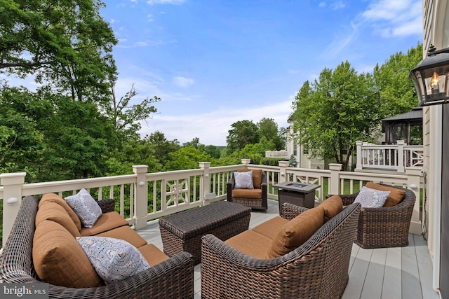 deck featuring outdoor lounge area