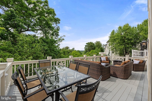 wooden deck with outdoor dining space