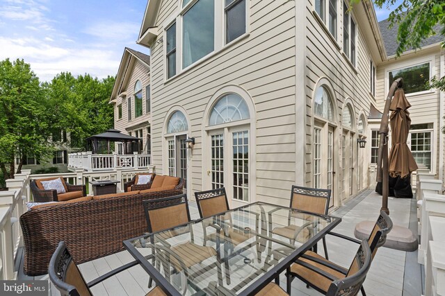 view of patio / terrace featuring outdoor dining space, a gazebo, and an outdoor living space