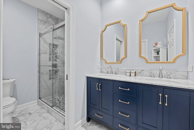 bathroom with marble look tile flooring, baseboards, a marble finish shower, toilet, and double vanity