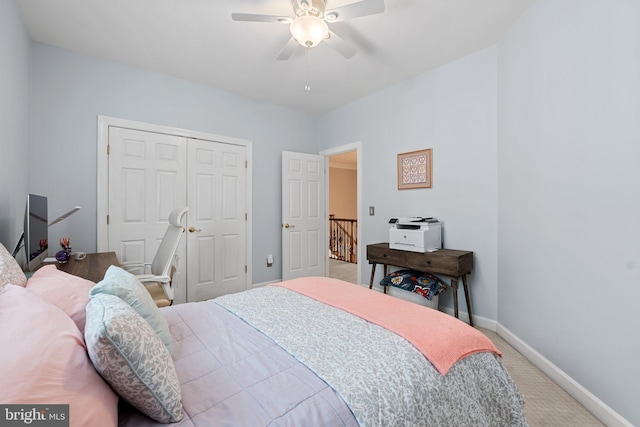 bedroom with carpet, baseboards, a closet, and ceiling fan