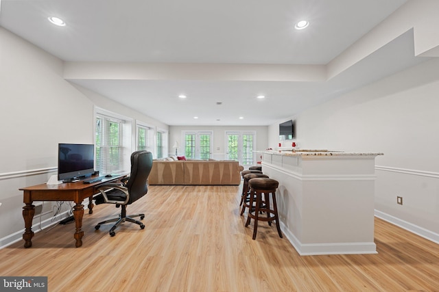 office space featuring light wood finished floors, baseboards, and recessed lighting