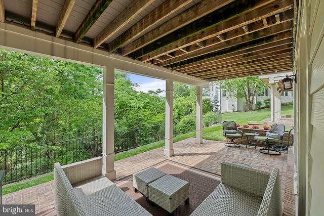 view of patio with fence and an outdoor hangout area