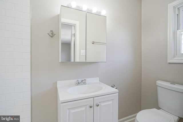 bathroom with toilet and vanity