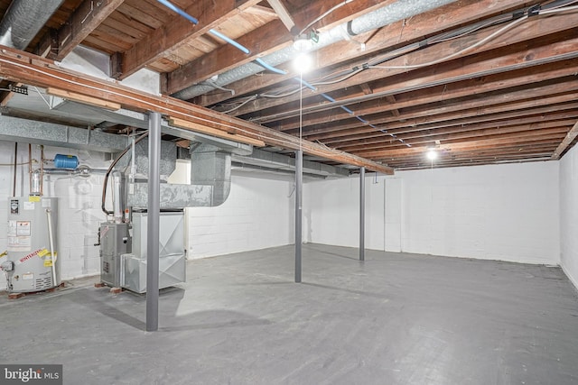 unfinished basement featuring water heater