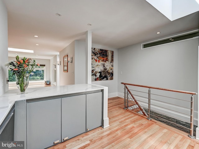2025 Skyline Rd, Towson, MD 21204 - bar featuring light wood finished floors, recessed lighting, baseboards, and a skylight