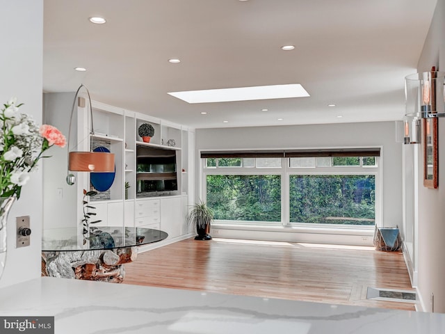 2025 Skyline Rd, Towson, MD 21204 - workout area featuring a skylight, healthy amount of natural light, wood finished floors, and recessed lighting