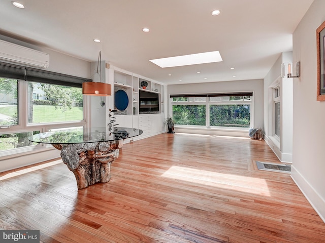 2025 Skyline Rd, Towson, MD 21204 - exercise room with a skylight, wood finished floors, baseboards, and recessed lighting
