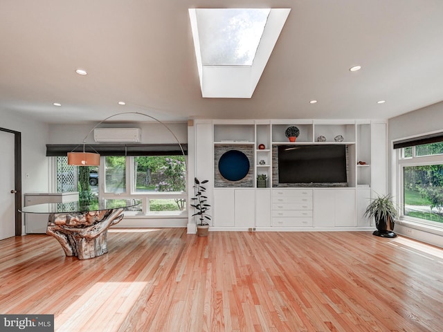 2025 Skyline Rd, Towson, MD 21204 - living area with a wall mounted AC, wood finished floors, recessed lighting, and a skylight