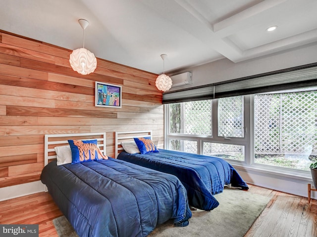 2025 Skyline Rd, Towson, MD 21204 - bedroom with wooden walls, wood finished floors, beam ceiling, recessed lighting, and a wall mounted AC