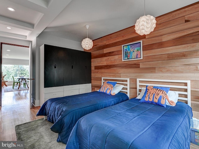 2025 Skyline Rd, Towson, MD 21204 - bedroom with wooden walls, wood finished floors, and recessed lighting