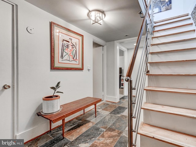 2025 Skyline Rd, Towson, MD 21204 - stairs featuring stone finish floors and baseboards