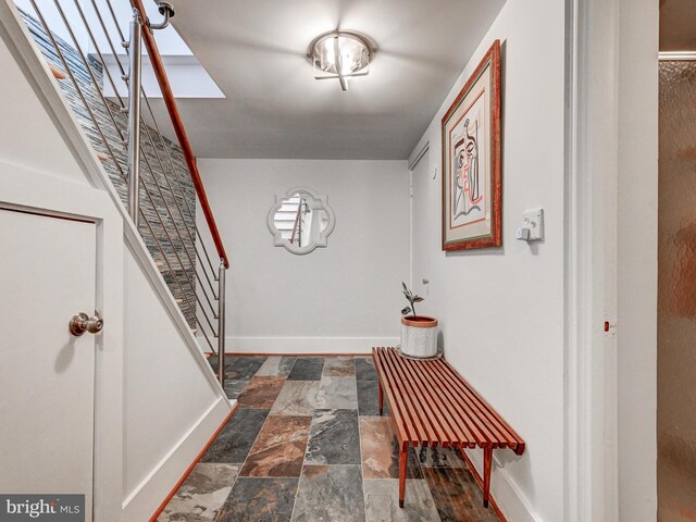 2025 Skyline Rd, Towson, MD 21204 - foyer featuring stairway, stone finish floors, and baseboards